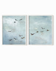 Set of 2 Flight - Flight I and II is a set of two abstract bird paintings featuring birds in flight against a softly textured cloudy sky in light blue, blue gray, cream, white, warm beige, brown, charcoal gray, and soft black; white oak frame by NLS Design. Large neutral gallery wall art for living rooms, bedrooms, entryways, offices, and above the couch and above the bed. Horizontal Sizes: 8x10, 11x14, 16x20, 18x24, 24x36, 30x40, 40x60 inches. nlsdesignllc.com. Real art by a real artist - NO AI
