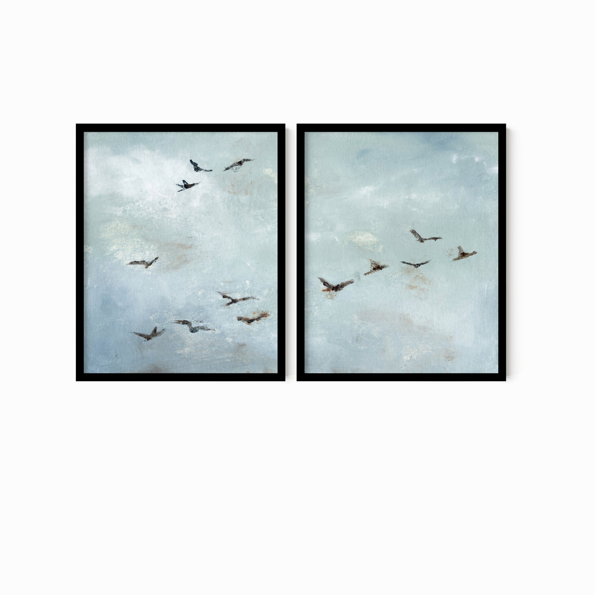 Set of 2 Flight - Flight I and II is a set of two abstract bird paintings featuring birds in flight against a softly textured cloudy sky in light blue, blue gray, cream, white, warm beige, brown, charcoal gray, and soft black; black oak frame by NLS Design. Large neutral gallery wall art for living rooms, bedrooms, entryways, offices, and above the couch and above the bed. Horizontal Sizes: 8x10, 11x14, 16x20, 18x24, 24x36, 30x40, 40x60 inches.  nlsdesignllc.com. Real art by a real artist - NO AI