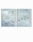 Set of 2 Flight - Flight I and II is a set of two abstract bird paintings featuring birds in flight against a softly textured cloudy sky in light blue, blue gray, cream, white, warm beige, brown, charcoal gray, and soft black; silver metal frame by NLS Design. Large neutral gallery wall art for living rooms, bedrooms, entryways, offices, and above the couch and above the bed. Horizontal Sizes: 8x10, 11x14, 16x20, 18x24, 24x36, 30x40, 40x60 inches.  nlsdesignllc.com. Real art by a real artist - NO AI