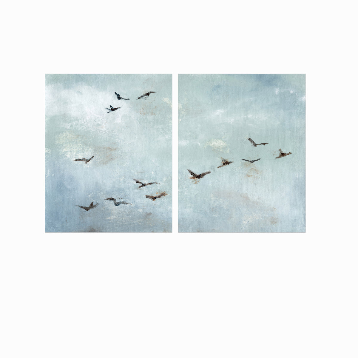 Set of 2 Flight - Flight I and II is a set of two abstract bird paintings featuring birds in flight against a softly textured cloudy sky in light blue, blue gray, cream, white, warm beige, brown, charcoal gray, and soft black; unframed by NLS Design. Large neutral gallery wall art for living rooms, bedrooms, entryways, offices, bathrooms, and above the couch and above the bed. Horizontal Sizes: 8x10, 11x14, 16x20, 18x24, 24x36, 30x40, 40x60 inches.  nlsdesignllc.com. Real art by a real artist - NO AI
